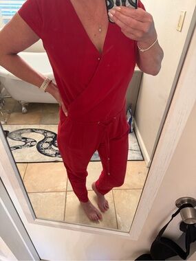 Very J brand size-med wrap around red romper with tie v neck closure